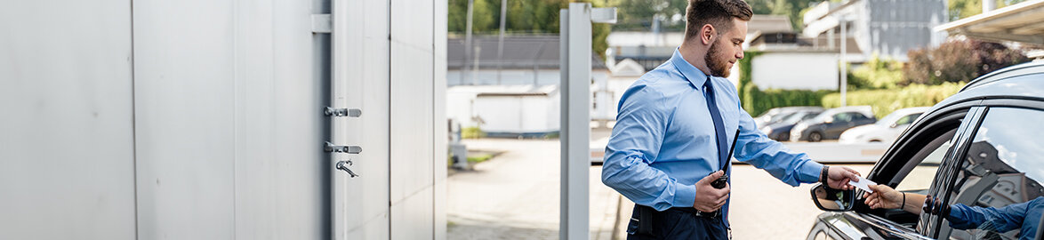 Safety specialist with headset in front of monitor