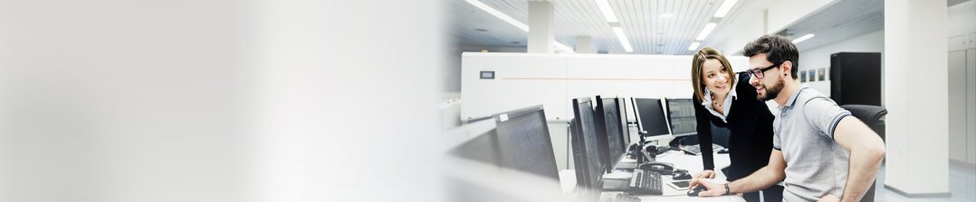 Two employees discuss