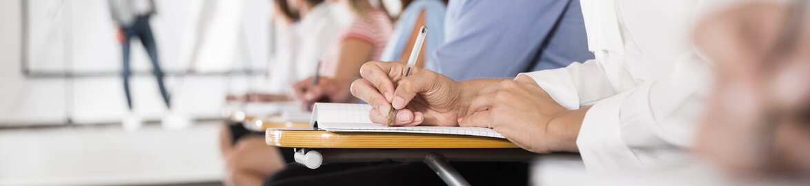 Writing hand in focus