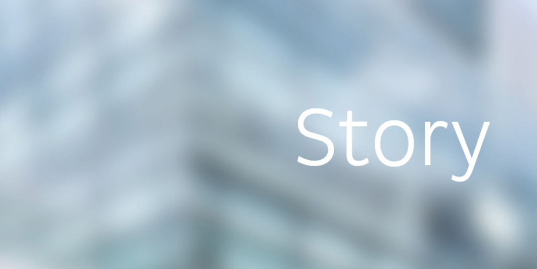 Blurred image of a building with writing story