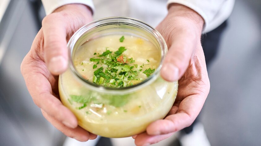 Soup bowl in two hands 