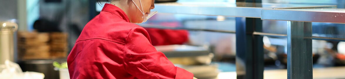 Onboard catering with VietAirjet Asian kitchen worker prepares food