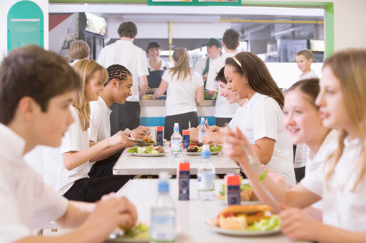 Pupils eat lunch in canteen