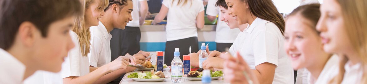 Pupils eat lunch in canteen