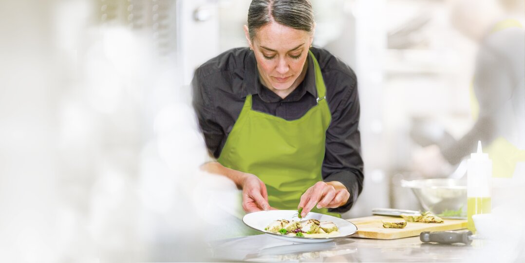 Cook decorates plate