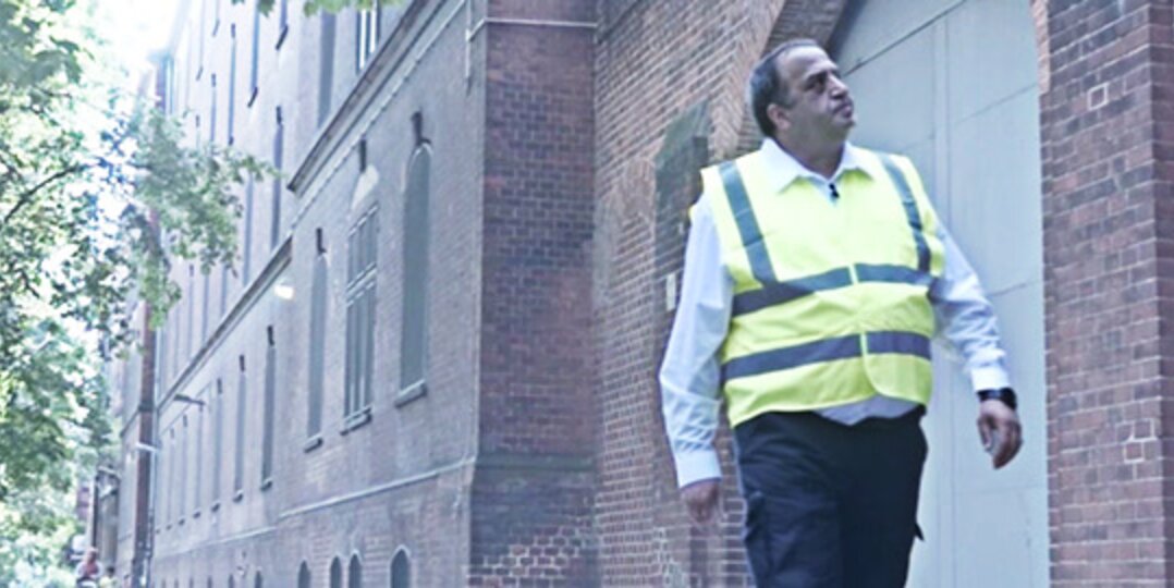 A Dussmann security employee looks after an old building. 
